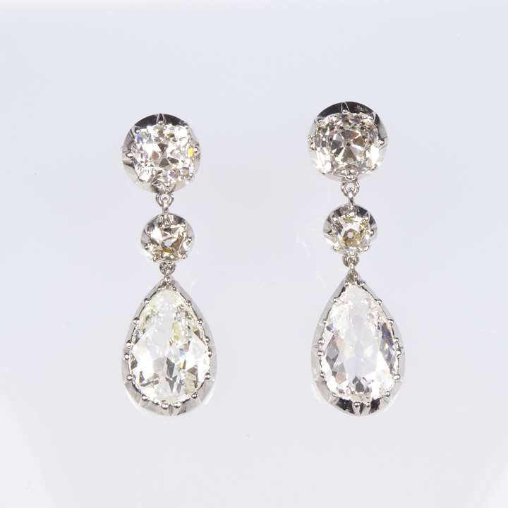 Pair of antique pear shaped diamond and platinum pendant earrings, cut-down collet set